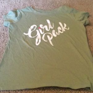 Short sleeve shirt with girl pack on it.